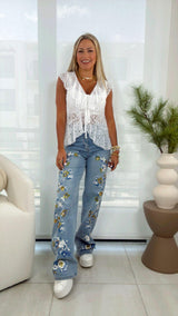 0600 Denim pants with sequin flowers
