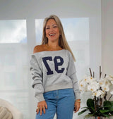 3196 Off-shoulder graphic sweater